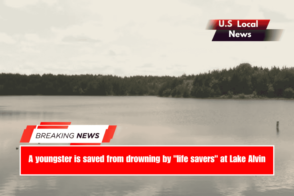 A youngster is saved from drowning by life savers at Lake Alvin