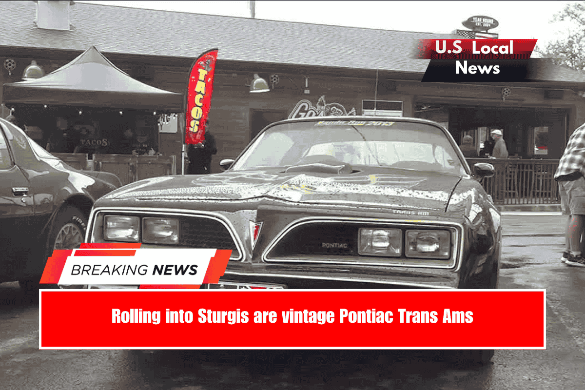 Rolling into Sturgis are vintage Pontiac Trans Ams