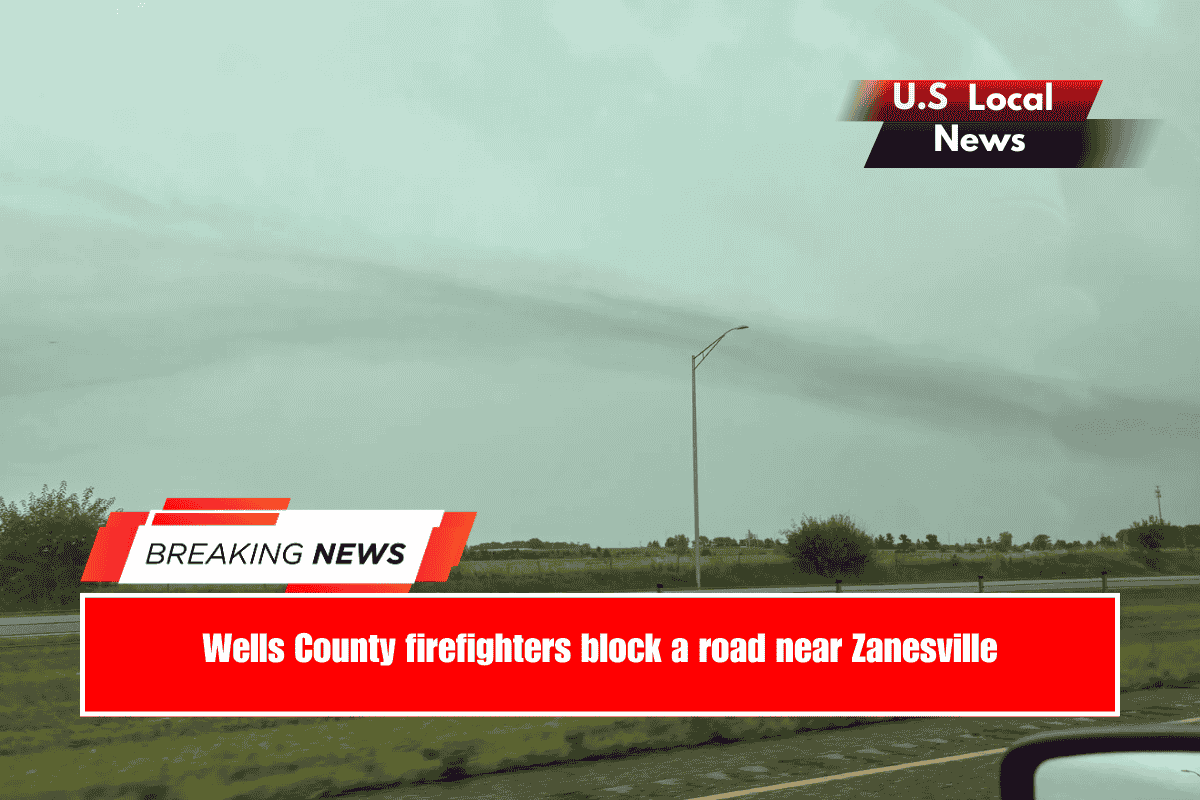 Wells County firefighters block a road near Zanesville